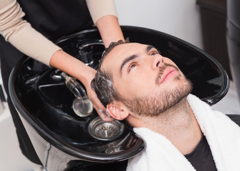A man washing hair with shampoo