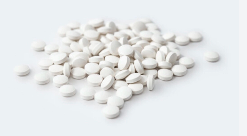 A stack of painkillers on a white background.