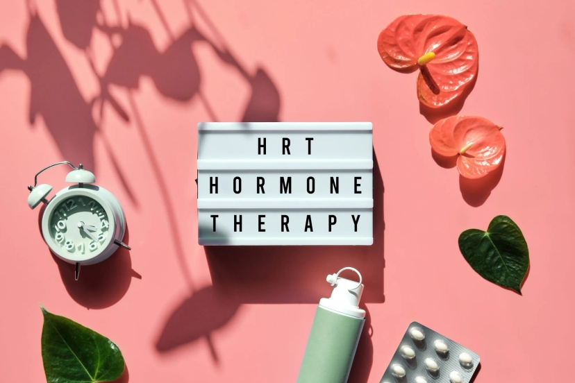 Hot hormone therapy on a pink background with plants and a clock. Introducing Auto Draft - an innovative approach to hormonal balance.