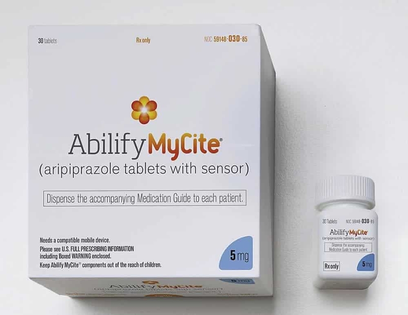 A box and bottle of Abilify Mycite (aripiprazole tablets with sensor), 5 mg dosage, designed with an innovative system to monitor how it works in the body.