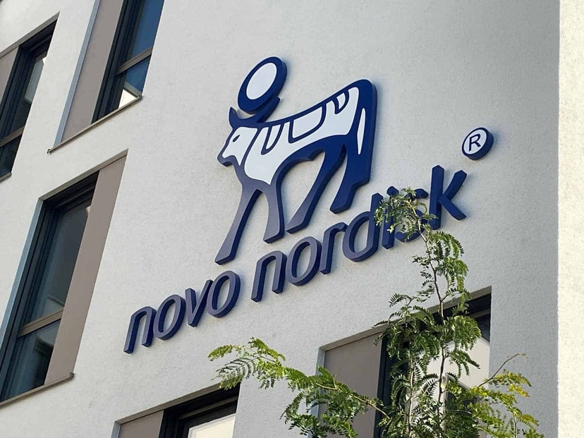 Novo Nordisk company logo, featuring Amycretin, displayed on the exterior of a building.