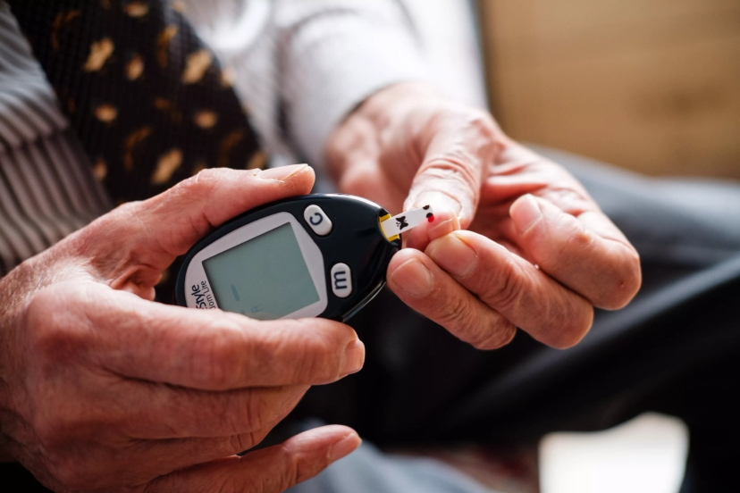 a person checking their blood sugar level which can be type 1 diabetes