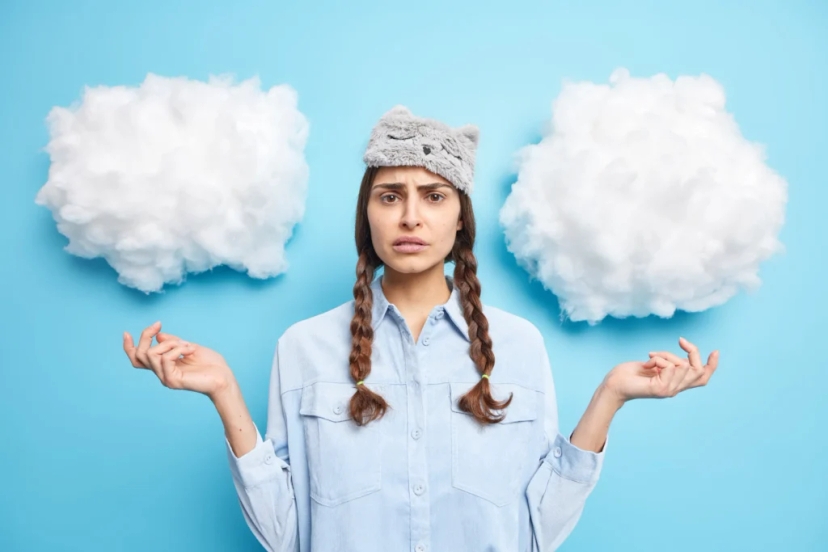 two clouds next to a person representing brain fog