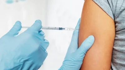 pneumonia vaccine being injected into the arm