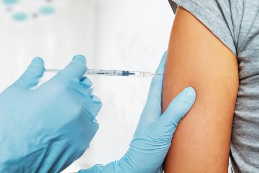 pneumonia vaccine being injected into the arm