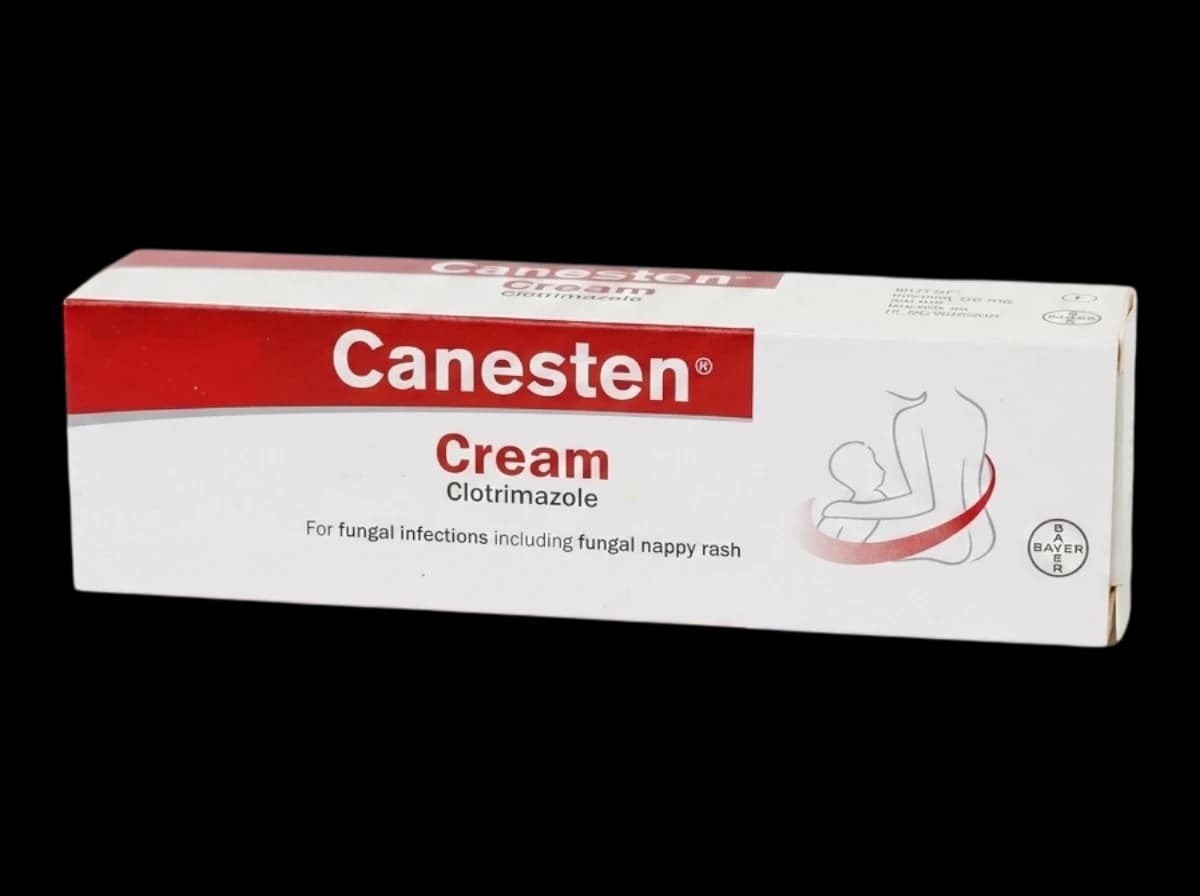 A box of Canesten cream on a white background.