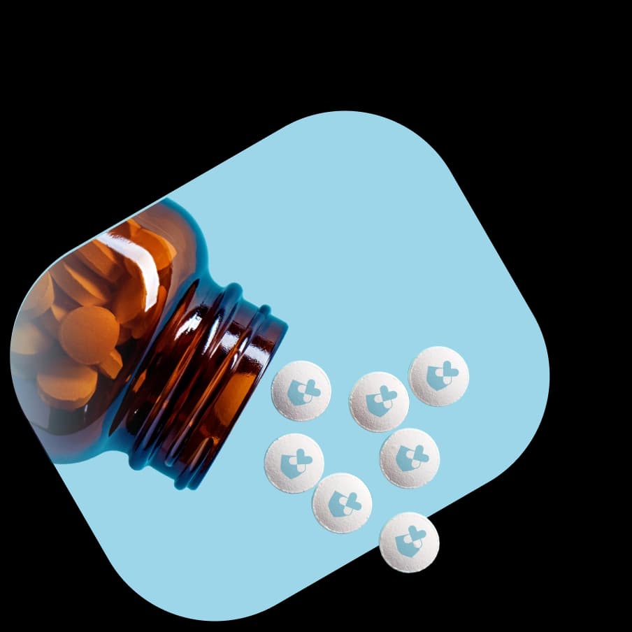 Tablets pouring out of a medication container