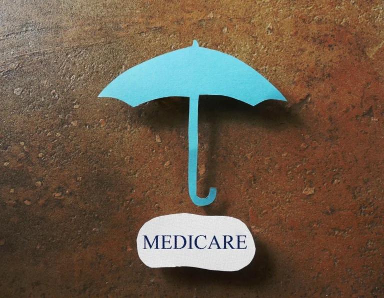 A blue umbrella with the word medicare on it, switch Medicare Advantage plans.