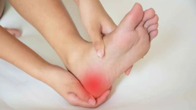A woman's foot is experiencing heel pain.