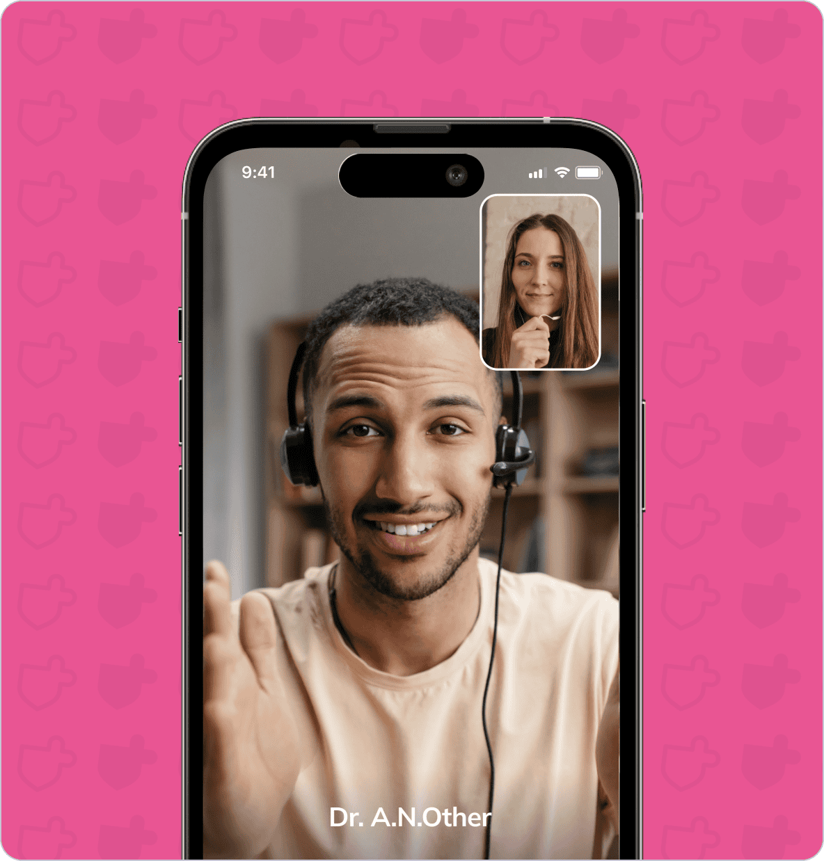 A smartphone screen displays a video call between a man wearing a headset and a woman. The man has a label that reads "Dr. A.N.Other." The background is a pink pattern.