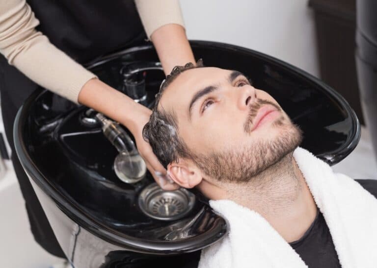 A man washing hair with shampoo