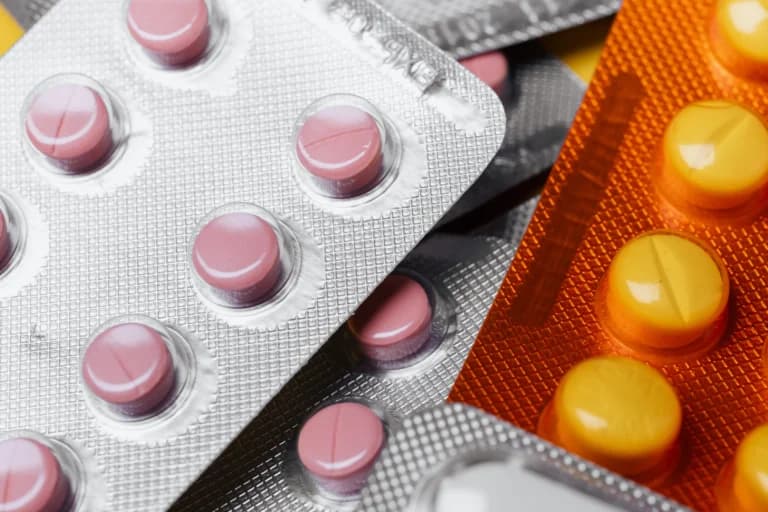 A close up of a pack of pills designed to help with prescription costs.