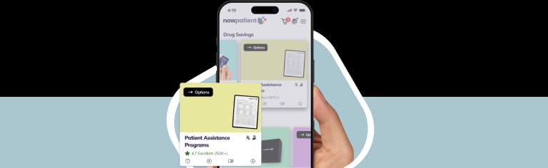 A hand holding a smartphone showing the NowPatient’s app screen, with a Patient Assistance Programs card rated 4.7 Excellent by 500+ users.