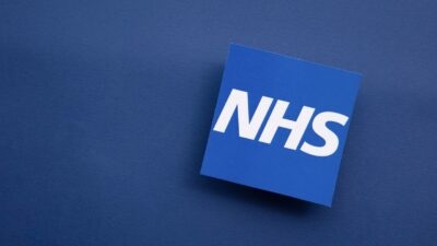 NHS 111 logo on a blue background, providing guidance on when to use it.