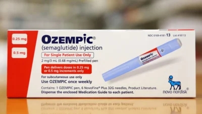 A box of Ozempic medication is placed on a table.