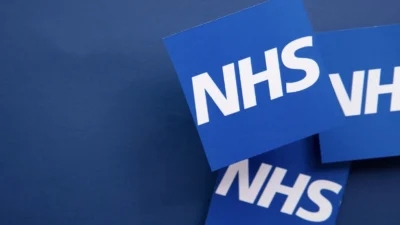 NHS logos on a blue background featuring Saxenda on NHS.
