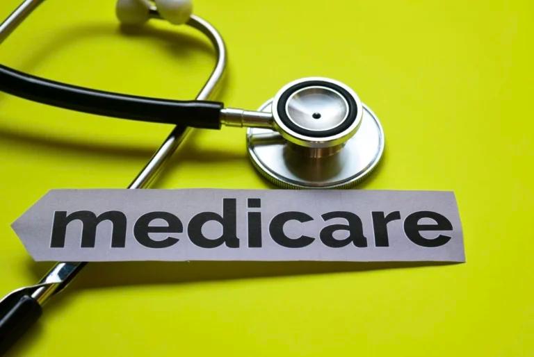 A stethoscope and medicare sign on a yellow background showcasing Medicare Advantage.