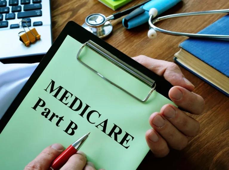 Costs and coverage of Medicare Part B depicted on a hand holding a clipboard.