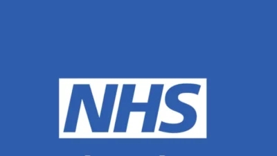 The NHS logo on a blue background promoting Pharmacy First.