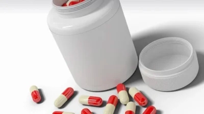 3d model of a pill bottle with red and white pills featuring prescription drug savings.