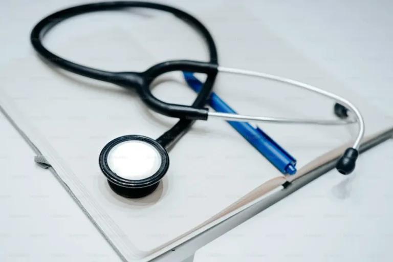 A stethoscope next to a notebook, representing the importance of understanding the enrollment penalty for Medicare Part D coverage.
