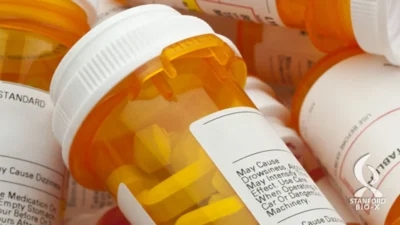 A group of prescription bottles stacked on top of each other, showcasing the Auto Draft feature.
