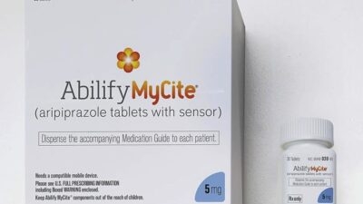 A box and bottle of Abilify Mycite (aripiprazole tablets with sensor), 5 mg dosage, designed with an innovative system to monitor how it works in the body.