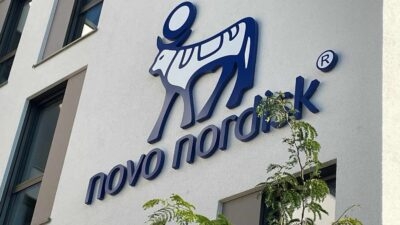 Novo Nordisk company logo, featuring Amycretin, displayed on the exterior of a building.