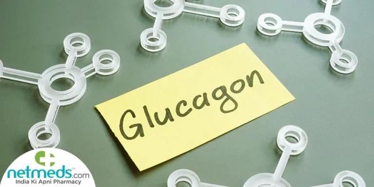 A sticky note with "Glucagon" written on it is placed among translucent molecular models on a green surface, hinting at the interplay of GLP-1 agonists benefits. Netmeds.com logo is visible in the lower left corner.