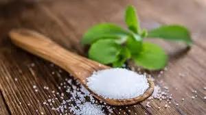 Stevia in a wooden spoon taking a look at Sugar Substitutes Cause Diarrhea